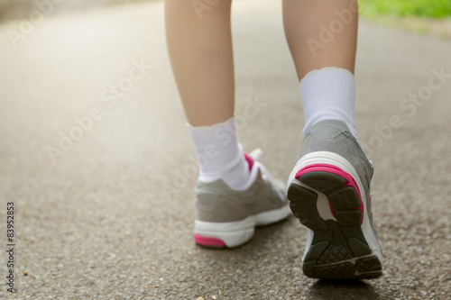 Young girl in running shoes. Healthy lifestyle concept. 