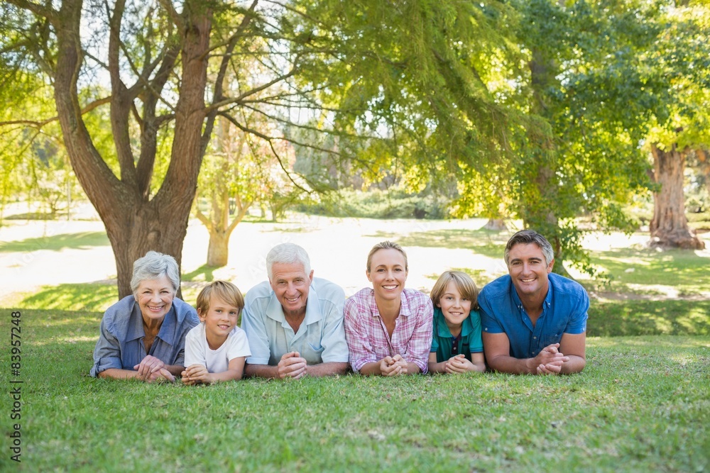 Happy family smiling at the camera 