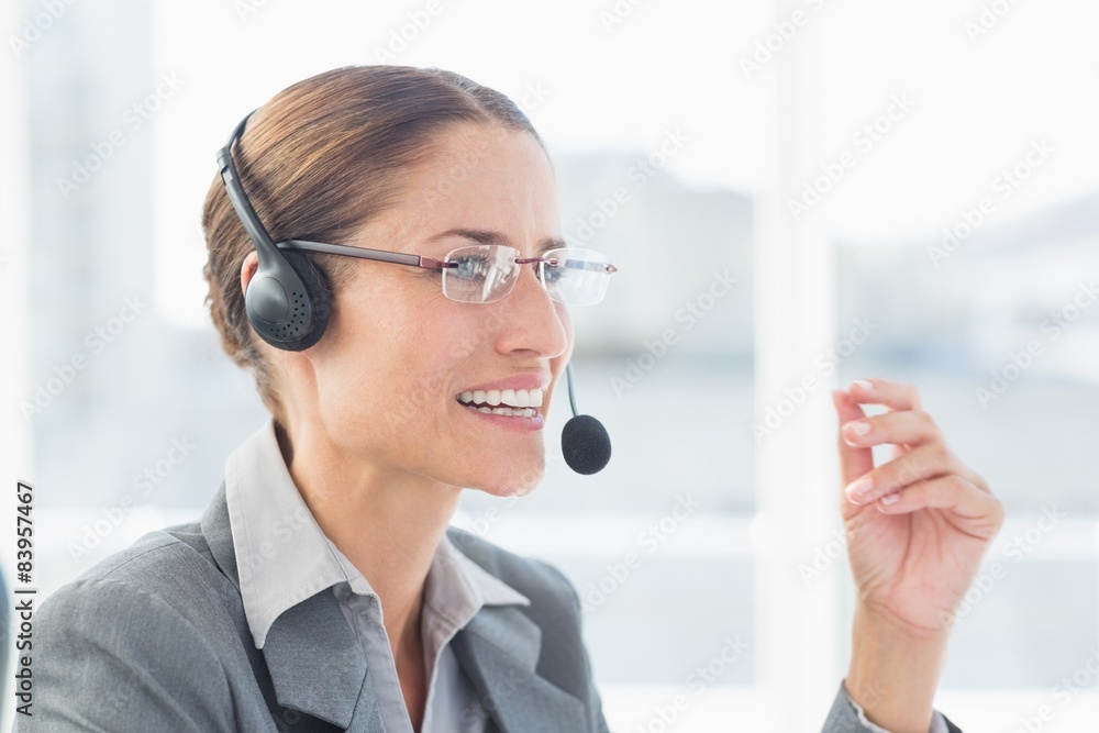 Businesswoman with headset in call centre Businesswoman with headset in call centre