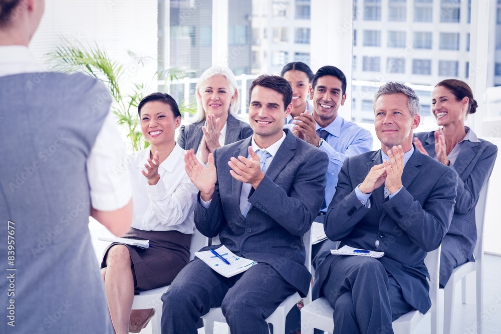 Business people applauding during meeting Business people applauding during meeting