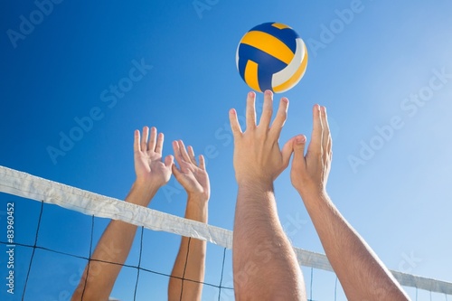Friends playing volleyball photo