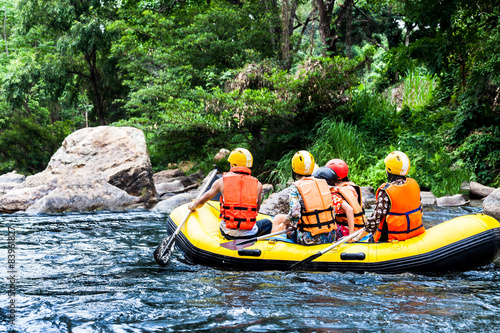 A group of men and women are rafting on the river, extreme and f