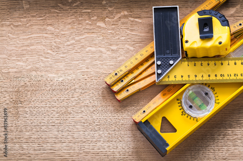Bilde på lerret Working tools of measurement on oaken wooden board construction