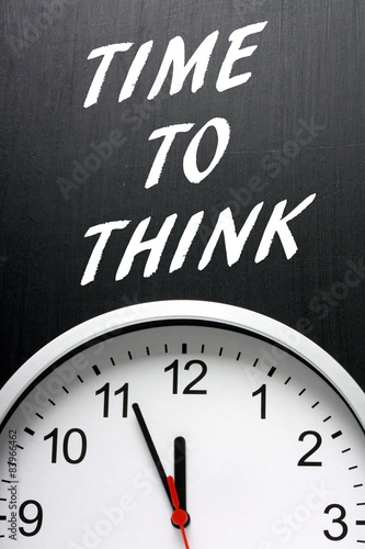 The phrase Time To Think on a blackboard with a clock