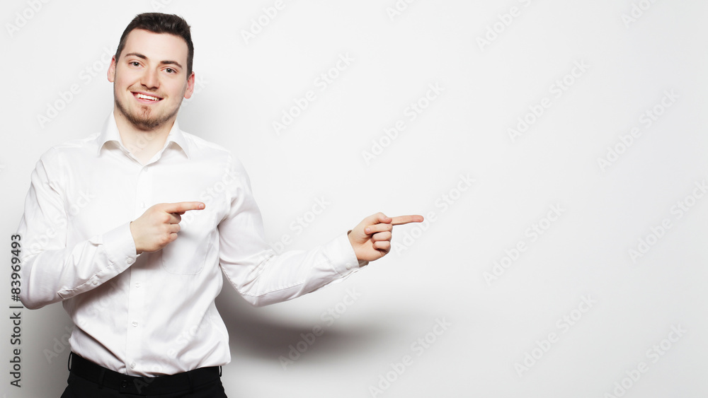 business man points with fingers in the right side business man points with fingers in the right side