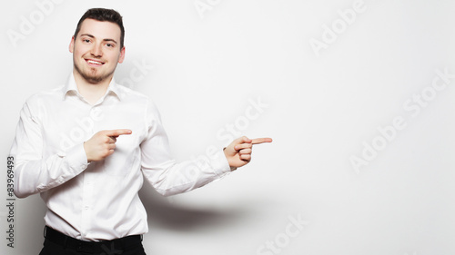 business man points with fingers in the right side