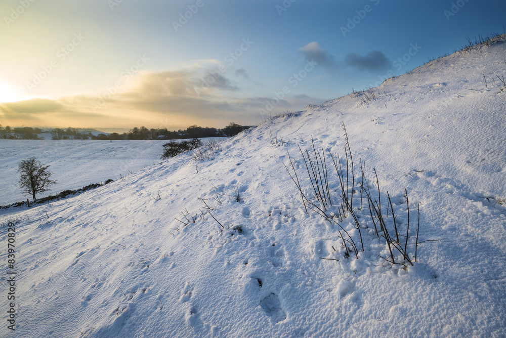 Beautiful snow covered sunrise Winter rural landscape