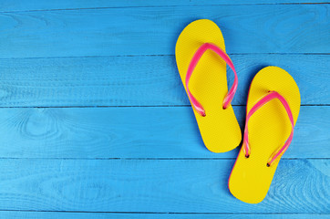 Flip Flops Yellow on blue wooden background
