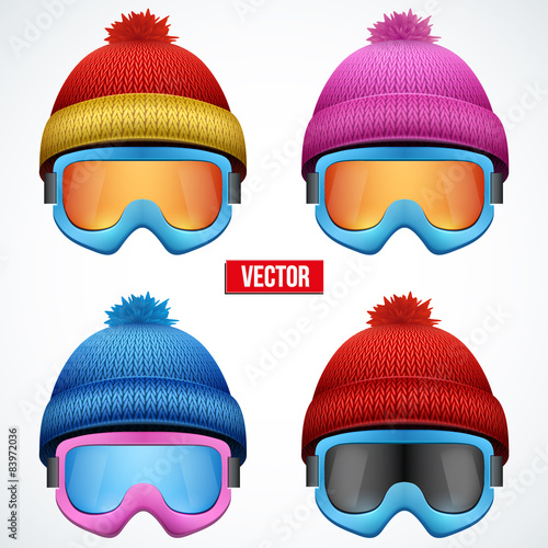 Knitted woolen cap with snow goggles. Winter seasonal sport hat.