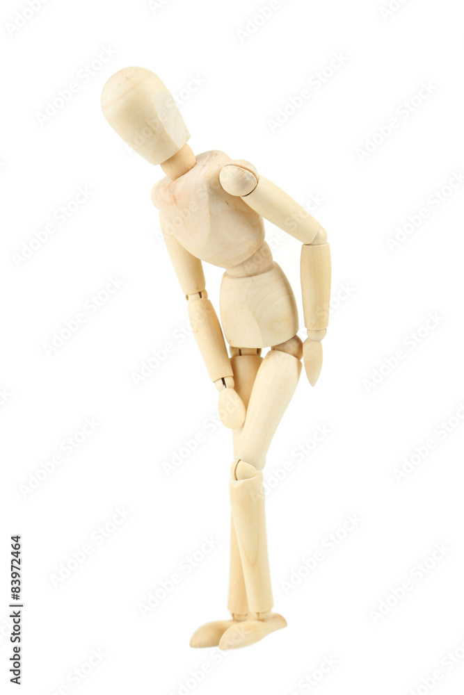 Wooden figure with knee pain isolated on white Wooden figure with knee pain isolated on white