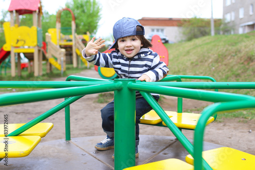 Little child on playground outdoors © ivolodina