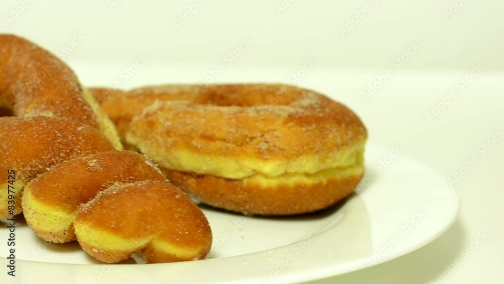sprinkle (pastry product) with sugar - white background studio sprinkle (pastry product) with sugar - white background studio