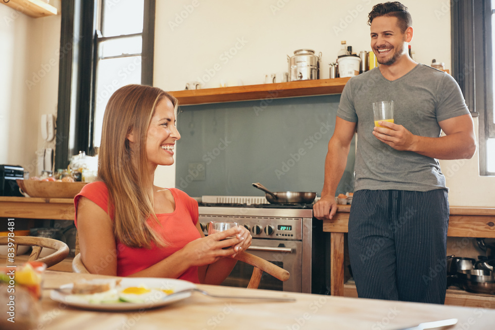 Happy young couple in the kitchen Happy young couple in the kitchen