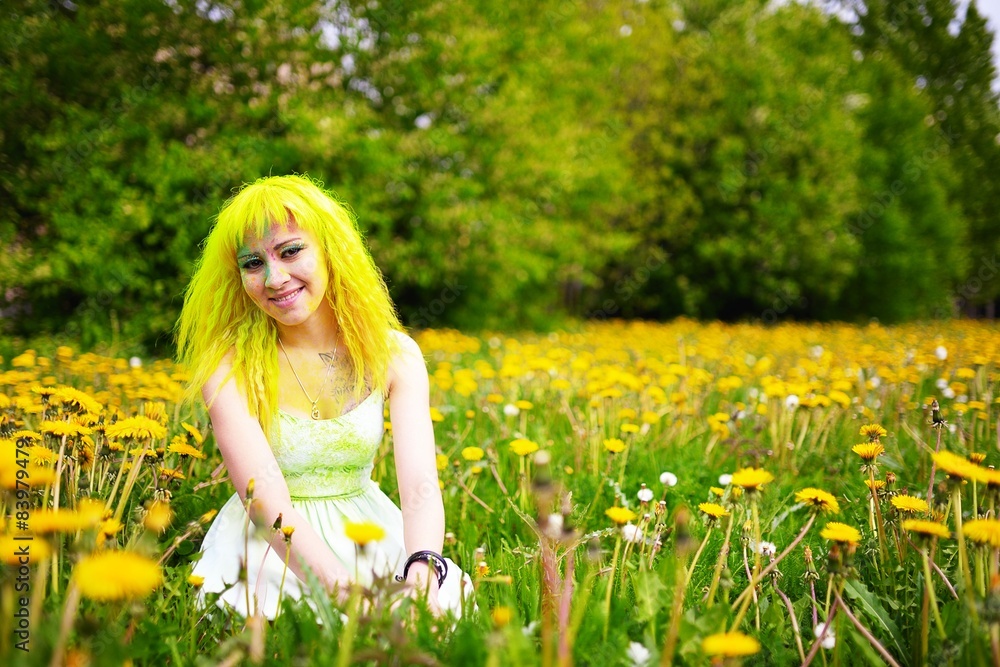 Beautiful young woman with yellow hair in grass with dandelion Beautiful young woman with yellow hair in grass with dandelion