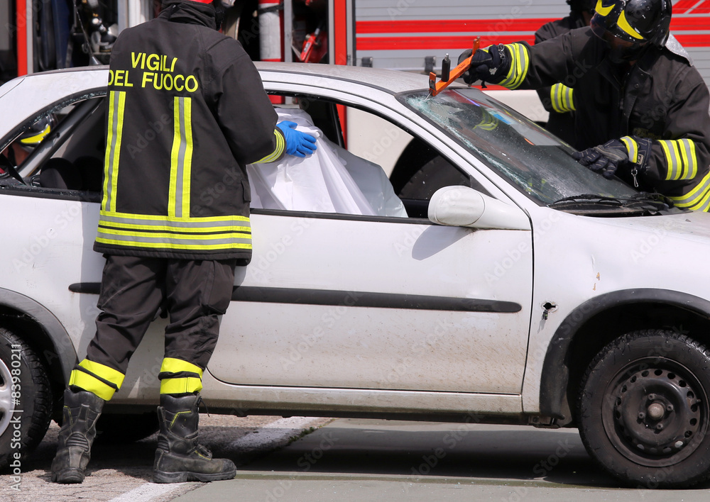 firefighters in action after the road accident firefighters in action after the road accident