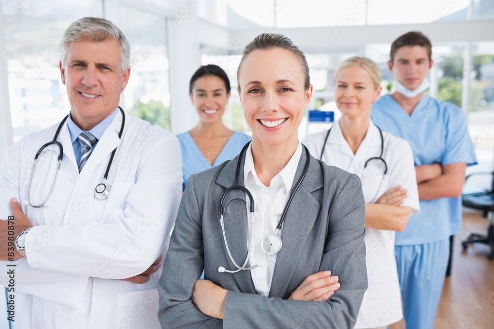 Fototapeta premium Smiling team of doctors looking at camera