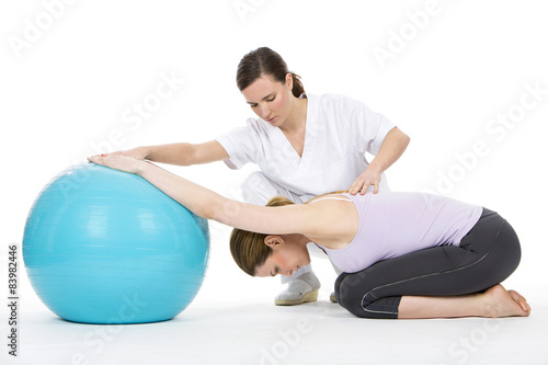 woman with physiotherapist exercising 