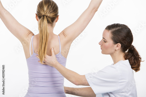 woman with physiotherapist exercising 