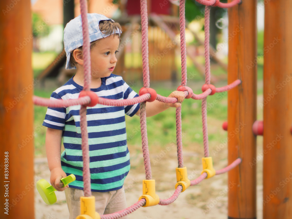 Little kid playing around the playground Little kid playing around the playground