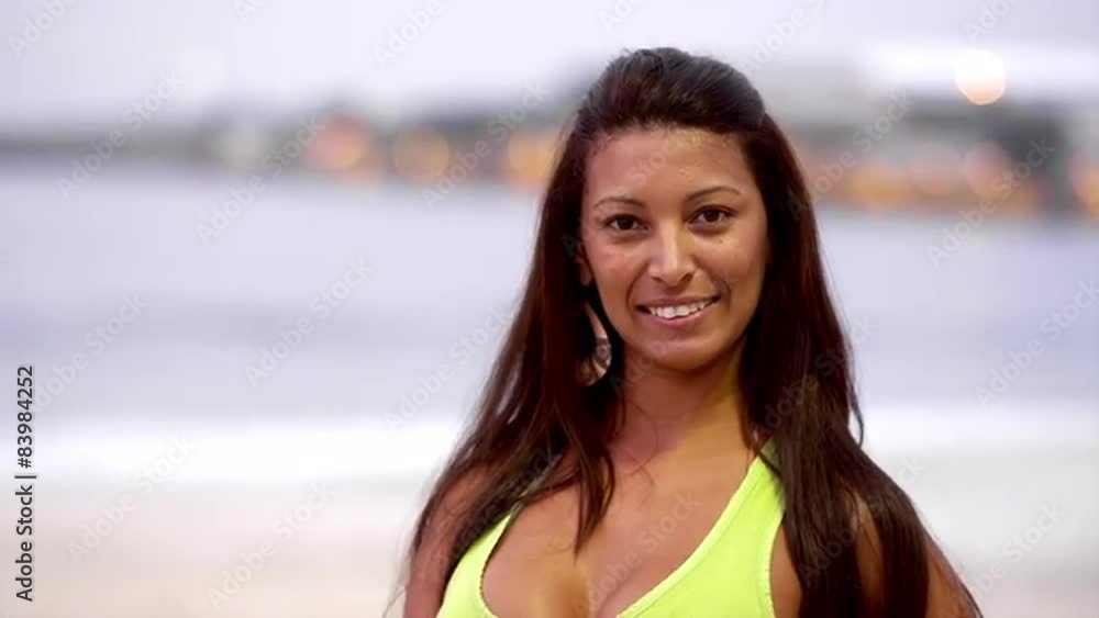 Beautiful Brazilian woman smiles on a beach in Brazil Beautiful Brazilian woman smiles on a beach in Brazil
