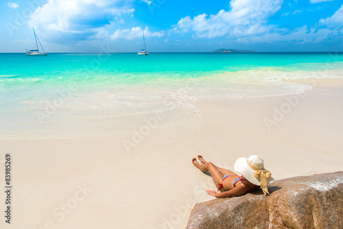 Girl at beautiful beach - Anse Georgette at Praslin - Seychelles
