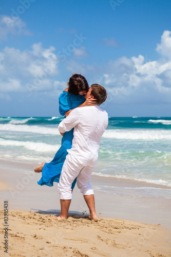 Beach couple walking on romantic travel.