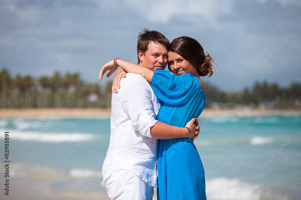 Beach couple walking on romantic travel.