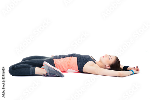 Sporty woman stretching isolated on a white background