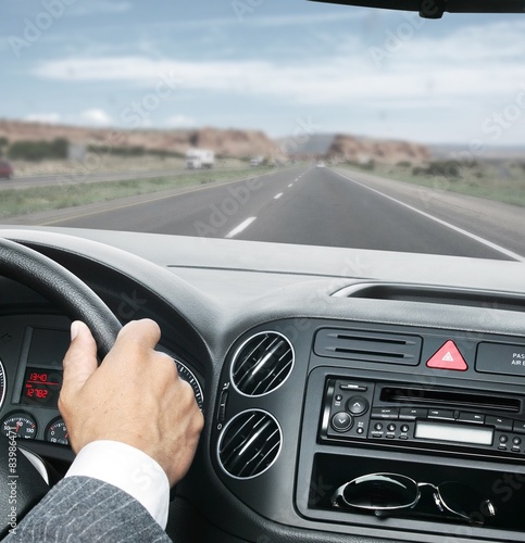 man driving with hands on the steering wheel clipping path