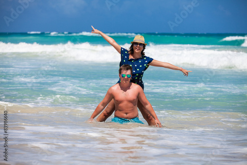 Couple have a fun in ocean's waves
