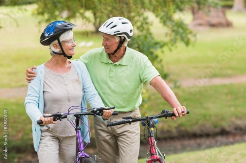 Happy senior couple on their bike