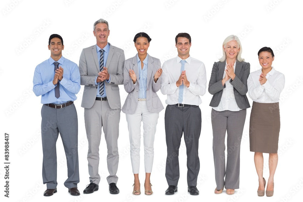Smiling business people applauding Smiling business people applauding