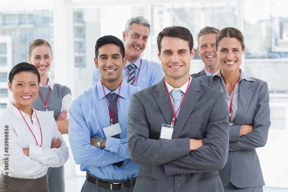 Business people looking at camera with arms crossed Business people looking at camera with arms crossed