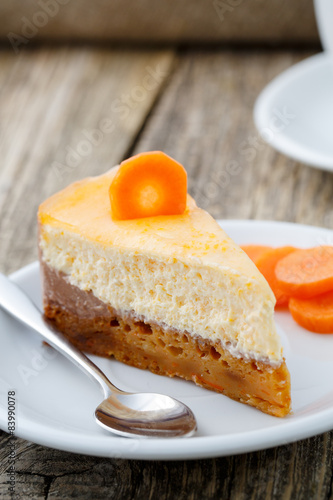 Sweet slice of carrot cake on white plate.