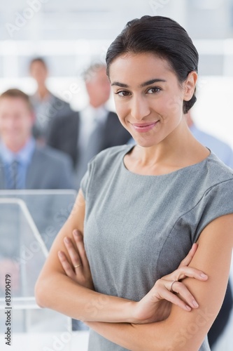 Smiling businesswoman looking at camera during conference Free Download Smiling businesswoman looking at camera during conference - GFXLoad