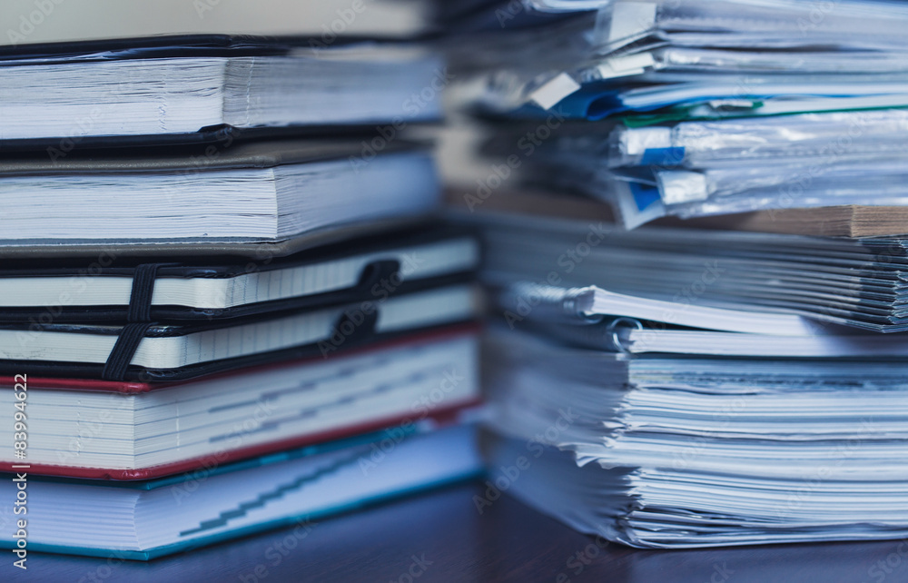 Accounting and taxes. Large pile of magazine and books Accounting and taxes. Large pile of magazine and books