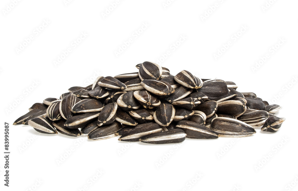 Sunflower seeds on a white background Sunflower seeds on a white background
