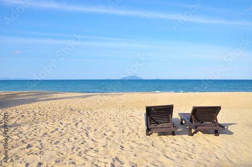Beach chairs on sand beach. with copy space area