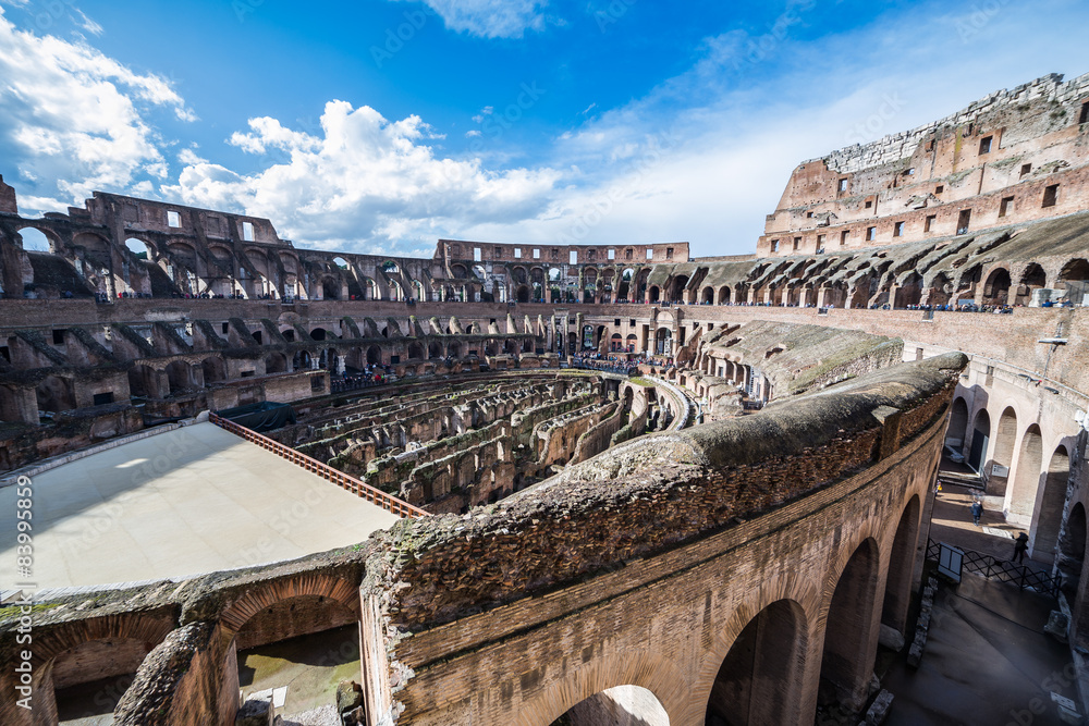 Internal view of the Coliseum in a sunny day in Rome, Italy.