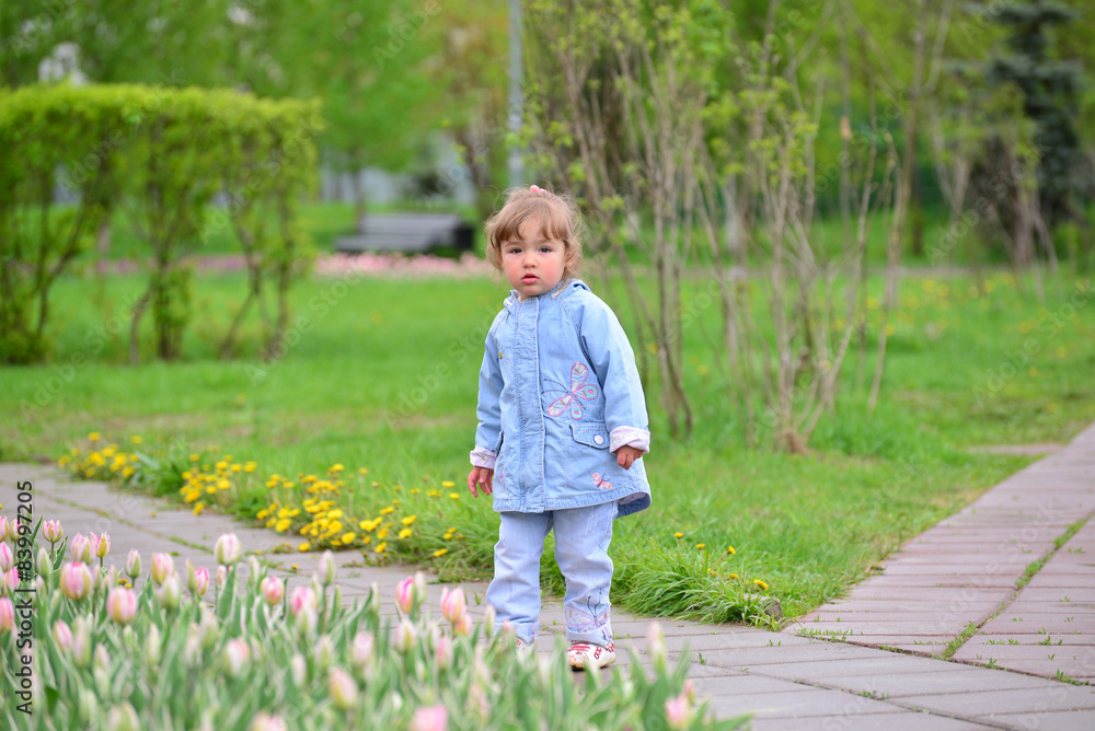 Cute baby girl with blonde curly hair outdoors. Cute baby girl with blonde curly hair outdoors.