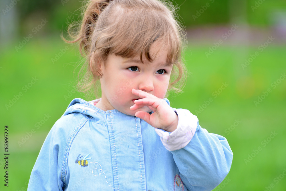 Cute baby girl with blonde curly hair outdoors. Cute baby girl with blonde curly hair outdoors.