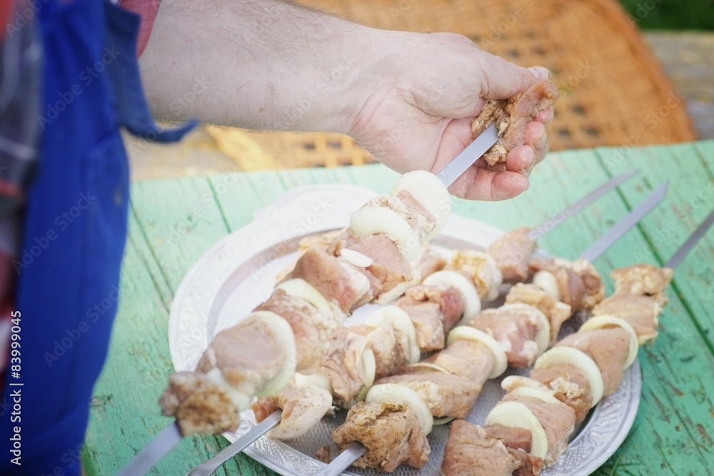 kebab skewers put on the meat on a skewer