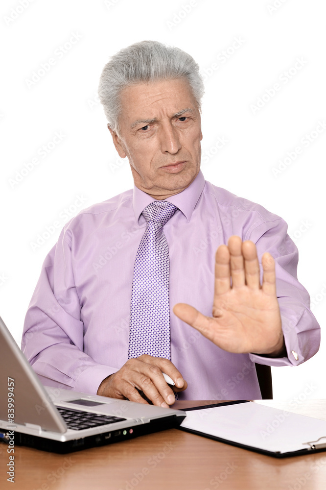 Old businessman working with notebook isolated Old businessman working with notebook isolated