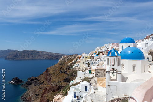 Fototapeta Naklejka Na Ścianę i Meble -  Blue and white church of Oia village on Santorini island. Greece