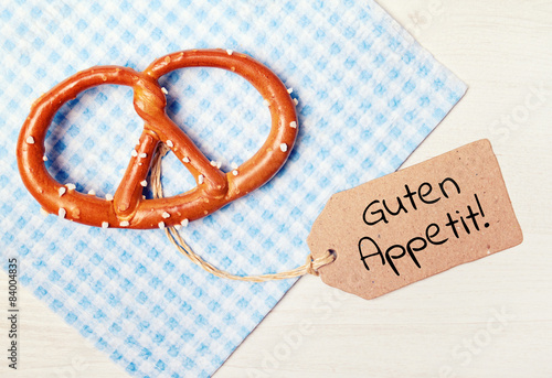 food background - pretzel on wood table - enjoy your meal photo