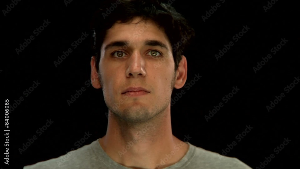 A young man looks up with a blank stare A young man looks up with a blank stare