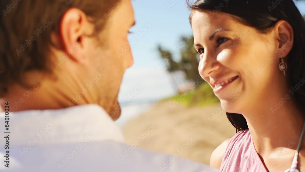 Attractive couple look into each other eyes and kiss. Attractive couple look into each other eyes and kiss.