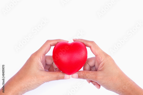 Stock Photo - Red heart in woman hand