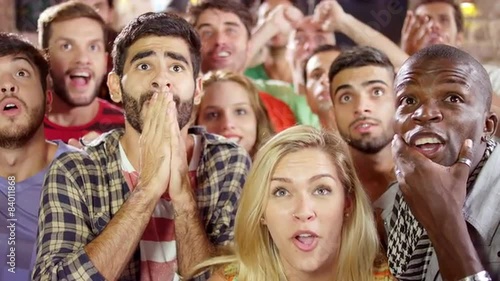 People Watching a Game at a Sports Bar in Brazil