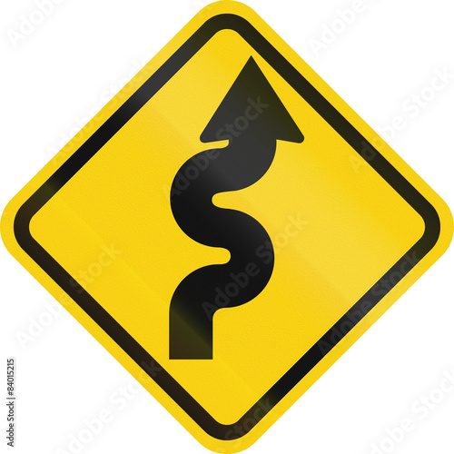 Colombian road warning sign: Winding road, right version